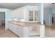 Kitchen with white cabinets and granite countertops with natural light from adjacent doorway and window at 4729 Peridia E Blvd, Bradenton, FL 34203