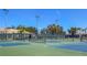 Inviting pickleball courts with shade, nets, and benches on a sunny day at 4729 Peridia E Blvd, Bradenton, FL 34203