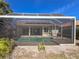 Large screened-in pool area with covered patio and lush landscaping, offering a private backyard oasis at 4729 Peridia E Blvd, Bradenton, FL 34203