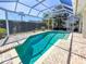 Inviting screened-in pool with a brick paver deck, perfect for hot summer days at 4729 Peridia E Blvd, Bradenton, FL 34203