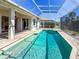 Well-maintained pool with brick pavers, screen enclosure, and access to the home, perfect for relaxation and enjoyment at 4729 Peridia E Blvd, Bradenton, FL 34203