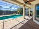 Gorgeous screened-in pool area with brick pavers and ceiling fans for ultimate relaxation at 4729 Peridia E Blvd, Bradenton, FL 34203