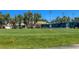 A putting green with players and manicured lawns at 4729 Peridia E Blvd, Bradenton, FL 34203