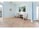 Sitting area with tile floors, blue accent wall, and comfortable chairs at 4729 Peridia E Blvd, Bradenton, FL 34203
