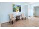 Sitting area with tile floors, blue accent wall, and comfortable chairs at 4729 Peridia E Blvd, Bradenton, FL 34203