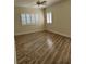 Bedroom featuring sleek tiled flooring, neutral walls, and plantation shutters on the windows at 4835 Gulf Of Mexico Dr # 106, Longboat Key, FL 34228