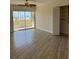 Bedroom with tiled floor, fan, large closet and sliding glass doors that lead to the outside at 4835 Gulf Of Mexico Dr # 106, Longboat Key, FL 34228