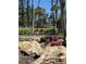 Beautiful landscaped garden with flowering shrubs and tropical trees at 4835 Gulf Of Mexico Dr # 106, Longboat Key, FL 34228