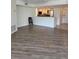 Open-concept living room boasts tile flooring, and seamless flow into the kitchen at 4835 Gulf Of Mexico Dr # 106, Longboat Key, FL 34228