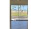 Beautiful beach view from a large sliding glass door overlooking lush green space at 4835 Gulf Of Mexico Dr # 106, Longboat Key, FL 34228