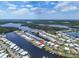 Aerial view showcasing the waterfront community with canal access and well-maintained landscaping at 517 Tampico Dr, North Port, FL 34287