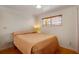 Comfortable bedroom featuring a simple design, a cozy bed, and natural light from the window at 517 Tampico Dr, North Port, FL 34287