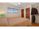 Comfortable bedroom with natural light, closet space, and simple decor at 517 Tampico Dr, North Port, FL 34287