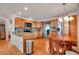 Updated kitchen features granite countertops, stainless steel appliances, and wood cabinetry at 517 Tampico Dr, North Port, FL 34287