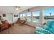 Bright sunroom featuring large windows with waterfront views, inviting natural light and warmth at 517 Tampico Dr, North Port, FL 34287
