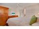 Spacious bedroom with ample closet space, a comfortable bed, and relaxing neutral tones at 517 Tampico Dr, North Port, FL 34287