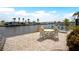 Waterfront patio with outdoor seating, a grill, and beautiful canal views at 517 Tampico Dr, North Port, FL 34287