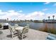 Outdoor patio with furniture overlooking the canal, perfect for entertaining or relaxing at 517 Tampico Dr, North Port, FL 34287