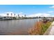 Serene waterfront view featuring homes, boats, and calm waters at 517 Tampico Dr, North Port, FL 34287