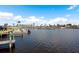 Beautiful waterfront view of the canal with a boat dock and calm water at 517 Tampico Dr, North Port, FL 34287
