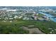Expansive aerial view showcasing The Landings with waterways, lush foliage, and multiple community buildings at 5230 Landings Blvd # 101, Sarasota, FL 34231