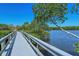 Scenic boardwalk showcasing views of the water surrounded by lush greenery, perfect for a peaceful stroll at 5230 Landings Blvd # 101, Sarasota, FL 34231