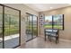 Breakfast nook featuring pond view with access to outdoor screened patio at 5230 Landings Blvd # 101, Sarasota, FL 34231