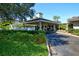 Inviting entrance to the clubhouse with a covered walkway and neatly maintained landscaping at 5230 Landings Blvd # 101, Sarasota, FL 34231