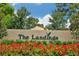 Welcoming entrance to The Landings, highlighted by lush landscaping and a clear blue sky at 5230 Landings Blvd # 101, Sarasota, FL 34231