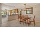 Light-filled dining room features a modern chandelier and a decorative mirror at 5230 Landings Blvd # 101, Sarasota, FL 34231
