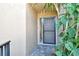 Close-up of the front door with glass screen and brick paver walkway at 5230 Landings Blvd # 101, Sarasota, FL 34231
