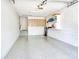 Garage with epoxy floor and storage cabinets at 5230 Landings Blvd # 101, Sarasota, FL 34231