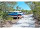 Convenient kayak storage racks along a scenic trail, ideal for water sports enthusiasts, in a beautiful setting at 5230 Landings Blvd # 101, Sarasota, FL 34231