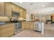 Well-lit kitchen features modern stainless steel appliances, granite countertops, and ample cabinet space at 5230 Landings Blvd # 101, Sarasota, FL 34231