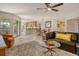 Open-concept living room with a seamless flow into the dining area and kitchen at 5230 Landings Blvd # 101, Sarasota, FL 34231