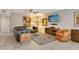 Cozy living room with comfortable seating, a shag rug, and modern decor at 5230 Landings Blvd # 101, Sarasota, FL 34231