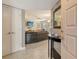 Inviting living room with tile floors and a glimpse into the adjacent dining area at 5230 Landings Blvd # 101, Sarasota, FL 34231