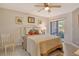 Serene bedroom with a queen-size bed, soft lighting, and sliding door access to the outdoor patio at 5230 Landings Blvd # 101, Sarasota, FL 34231