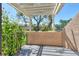 Outdoor patio area with a view of trees and building at 5230 Landings Blvd # 101, Sarasota, FL 34231