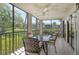 Screened patio offers picturesque water views with seating for outdoor dining at 5230 Landings Blvd # 101, Sarasota, FL 34231