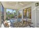 Inviting screened-in patio with comfortable seating overlooks a serene water view at 5230 Landings Blvd # 101, Sarasota, FL 34231