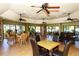 Bright recreation room with multiple tables, seating, and ample natural light, perfect for gatherings at 5230 Landings Blvd # 101, Sarasota, FL 34231