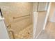 Walk-in shower featuring gray tile walls and a mosaic tile floor at 5230 Landings Blvd # 101, Sarasota, FL 34231
