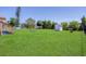 Large backyard featuring a shed, fire pit, and ample lawn space at 5231 32Nd E St, Bradenton, FL 34203