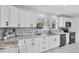 Modern kitchen featuring white cabinets, stylish backsplash and countertops at 5231 32Nd E St, Bradenton, FL 34203