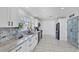 Modern kitchen with white cabinets, stainless-steel appliances, and subway tile backsplash at 5231 32Nd E St, Bradenton, FL 34203