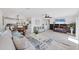 Bright living room with tile floors and a view into the modern kitchen at 5231 32Nd E St, Bradenton, FL 34203