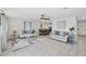 Open-concept living room featuring tile floors and views to the dining area at 5231 32Nd E St, Bradenton, FL 34203