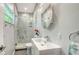 Modern bathroom featuring a glass-enclosed shower, sleek vanity, and stylish fixtures at 5324 Siesta Ct, Sarasota, FL 34242