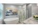 Luxurious bathroom with a soaking tub, walk-in shower, and marble countertop at 5324 Siesta Ct, Sarasota, FL 34242